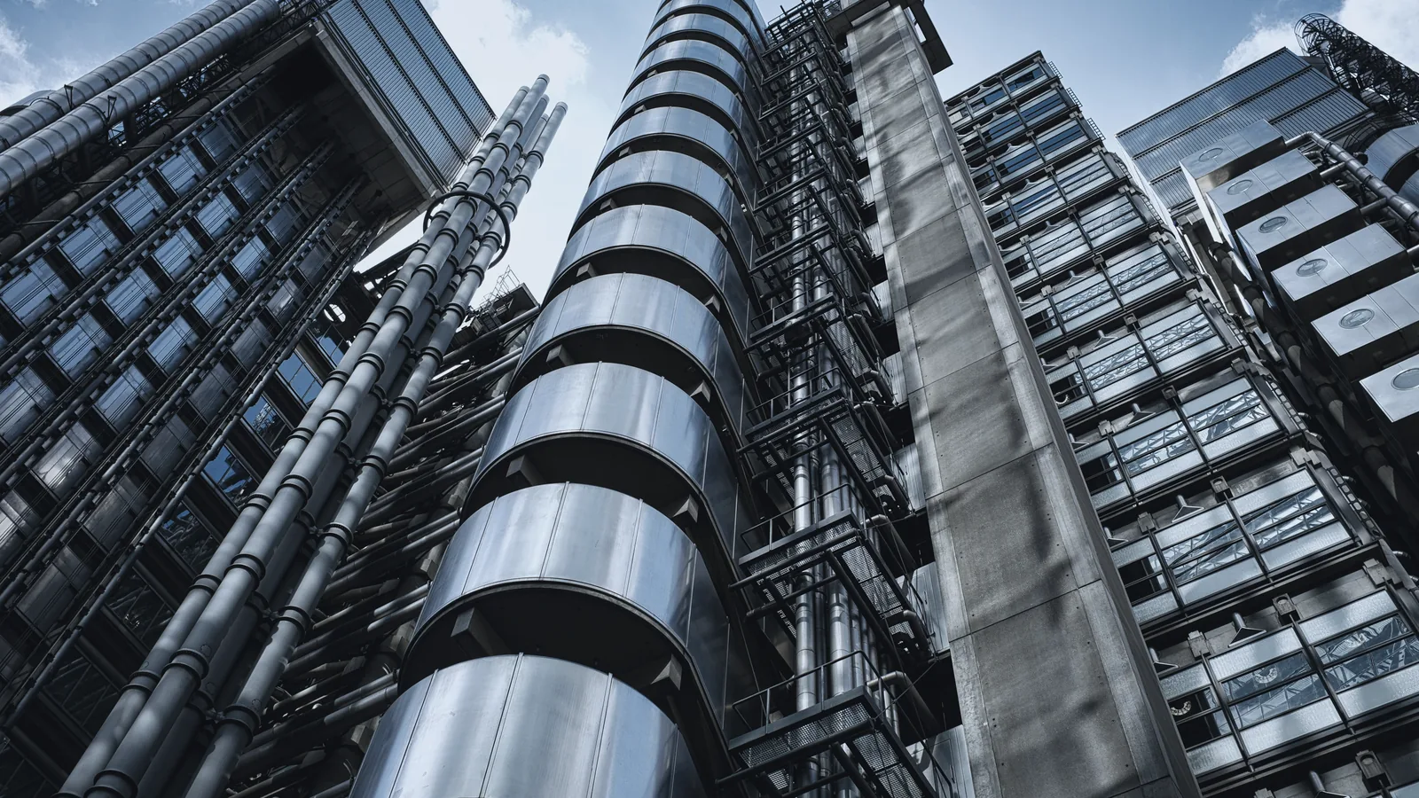 The Lloyd's building, stainless lift towers against a morning sky
