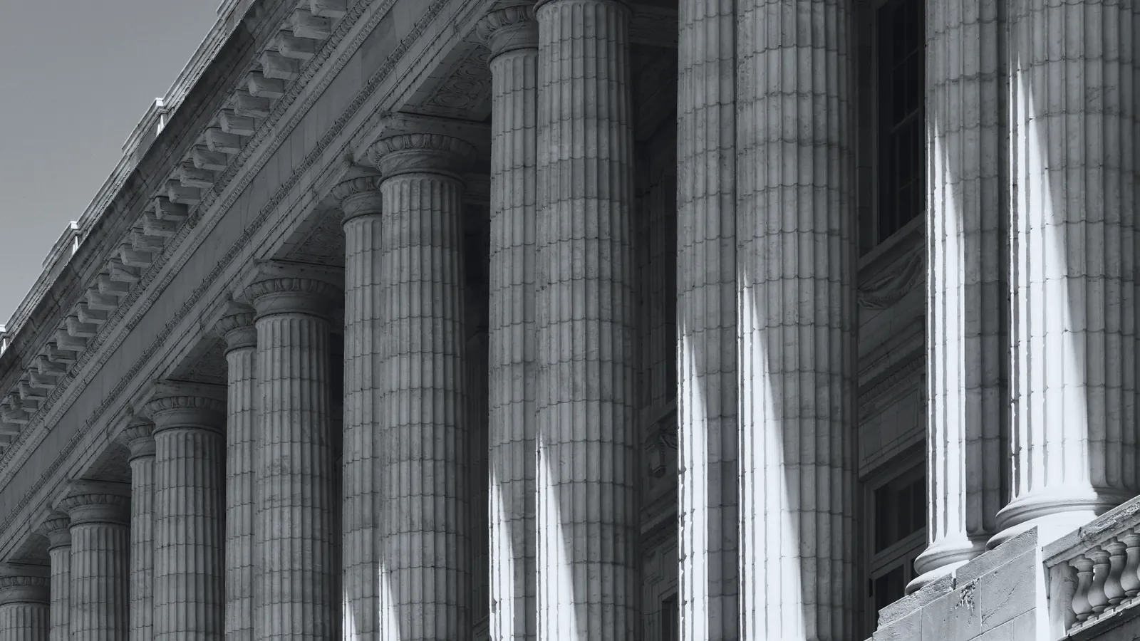 Classical colonnade with raking shadows